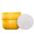 Yellow container of "The Pads" ingrown hair eliminator with 30 pads for skincare and grooming with a white round pad beside it.