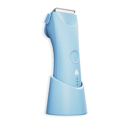Compact light blue cordless electric hair clipper with adjustable length settings and charging stand for grooming.