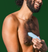 Man using the trimmer on his chest area