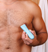 Man using the Meridian Slimmer Trimmer to groom chest hair