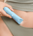 Woman using the Meridian Slimmer Trimmer to groom her inguinal area