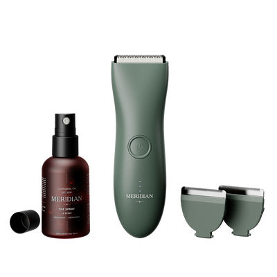 Meridian grooming kit featuring an electric trimmer with two replacement blades and a bottle of deodorant spray.
