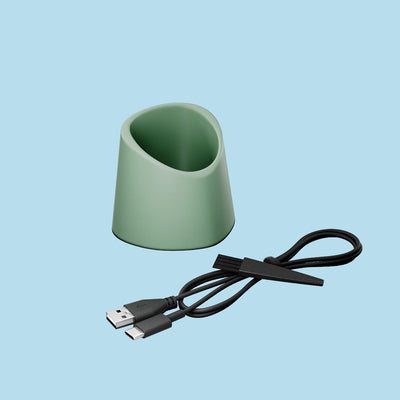 Sage colored charging dock with USB-C cable