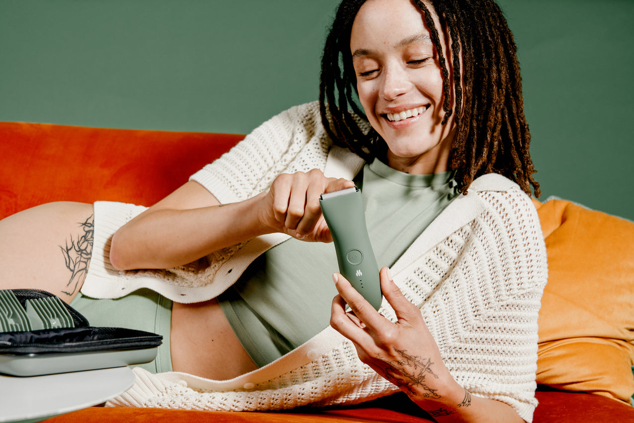 Woman holding the Meridian Trimmer in Sage color