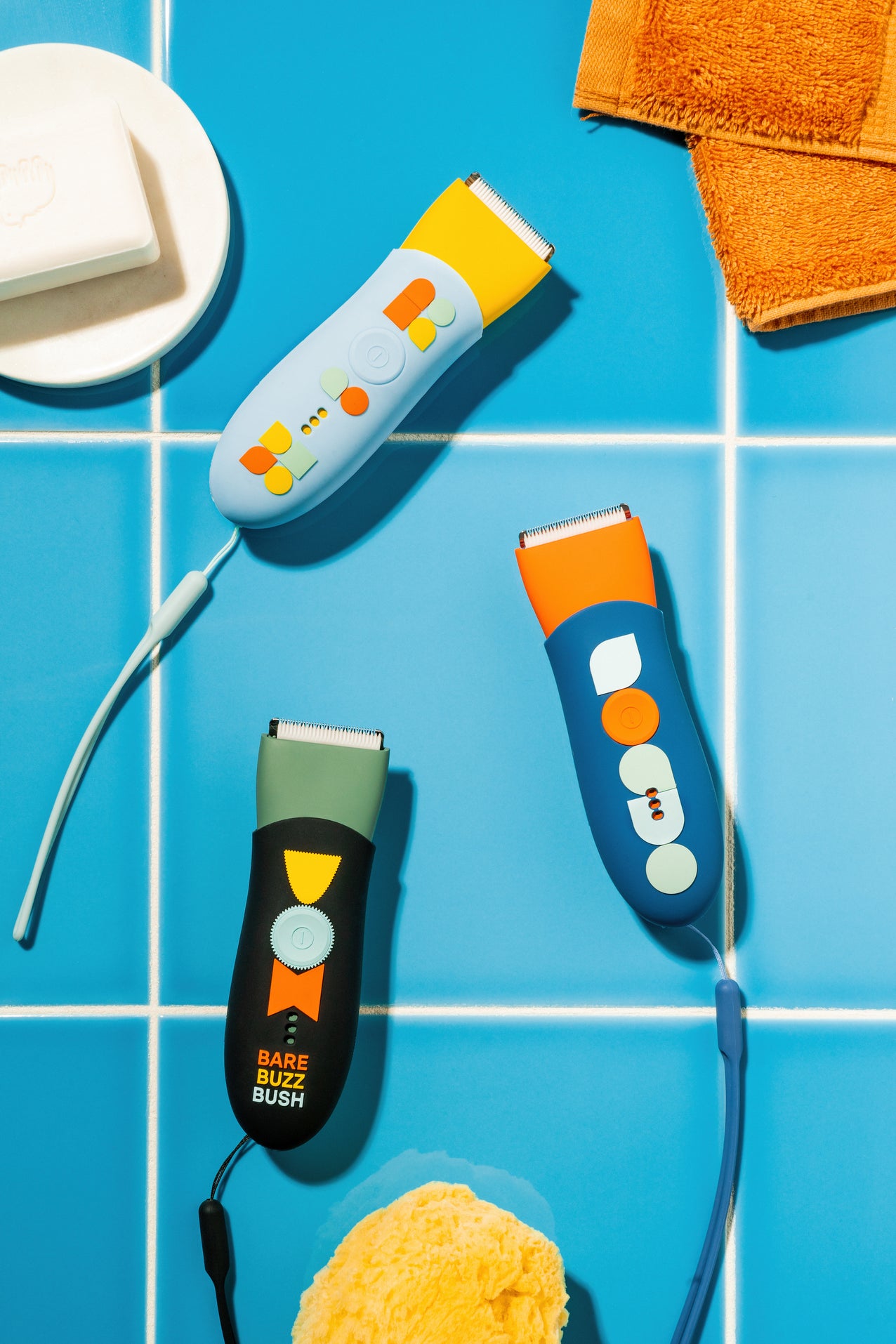 Meridian trimmers with color sleeves: Sky sleeve on Solar trimmer, Onyx sleeve on Sage trimmer, and Ocean sleeve on Blaze trimmer.