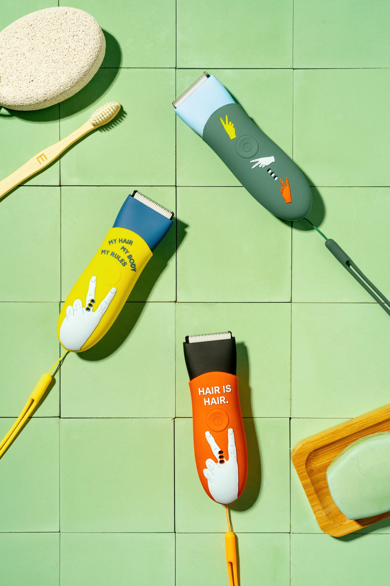 Meridian trimmers with color sleeves: Sage sleeve on Sky trimmer, Solar sleeve on Ocean trimmer, and Blaze sleeve on Onyx trimmer.