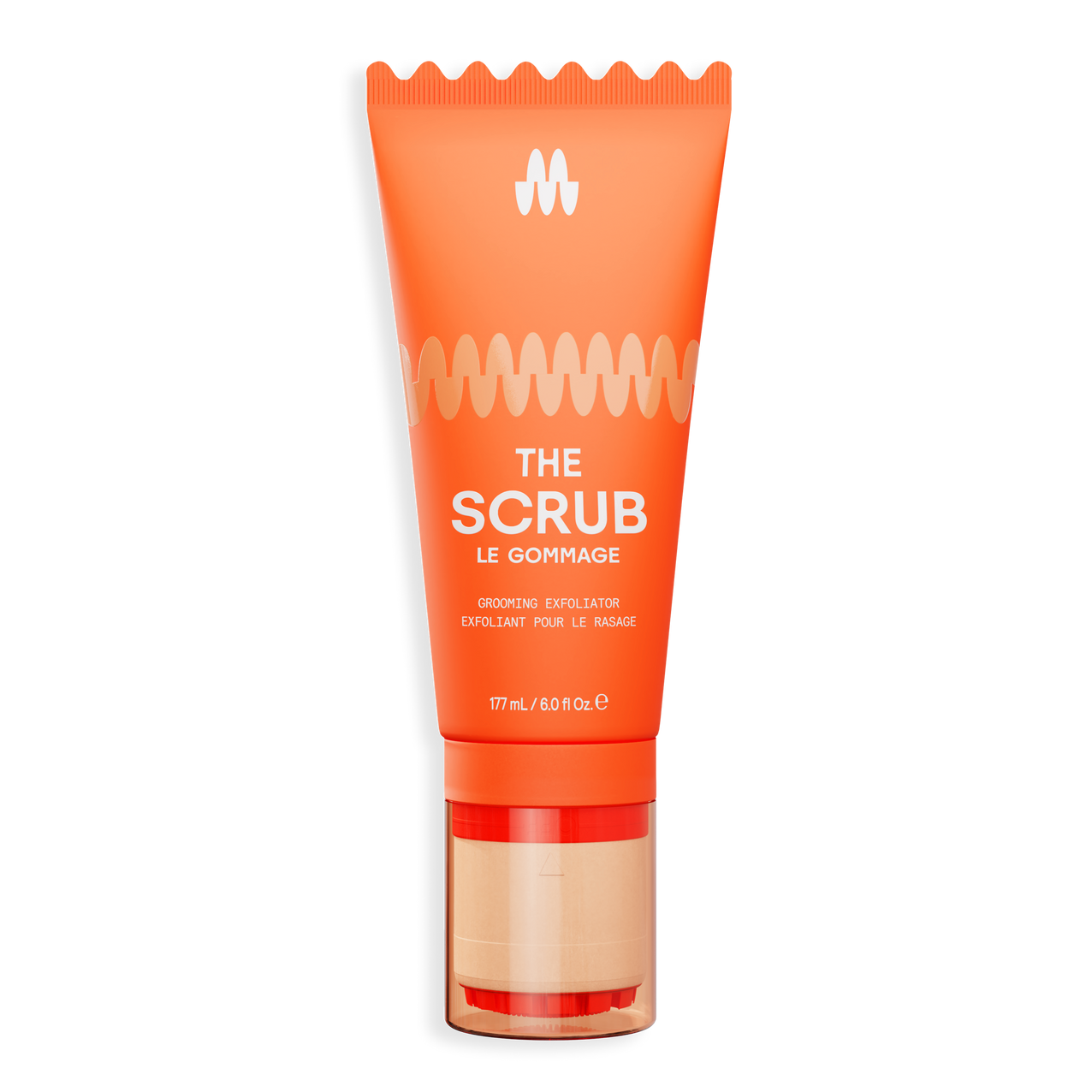 Orange exfoliating face scrub tube with gold and beige pump, labeled "The Scrub" for gentle skin renewal and detox.