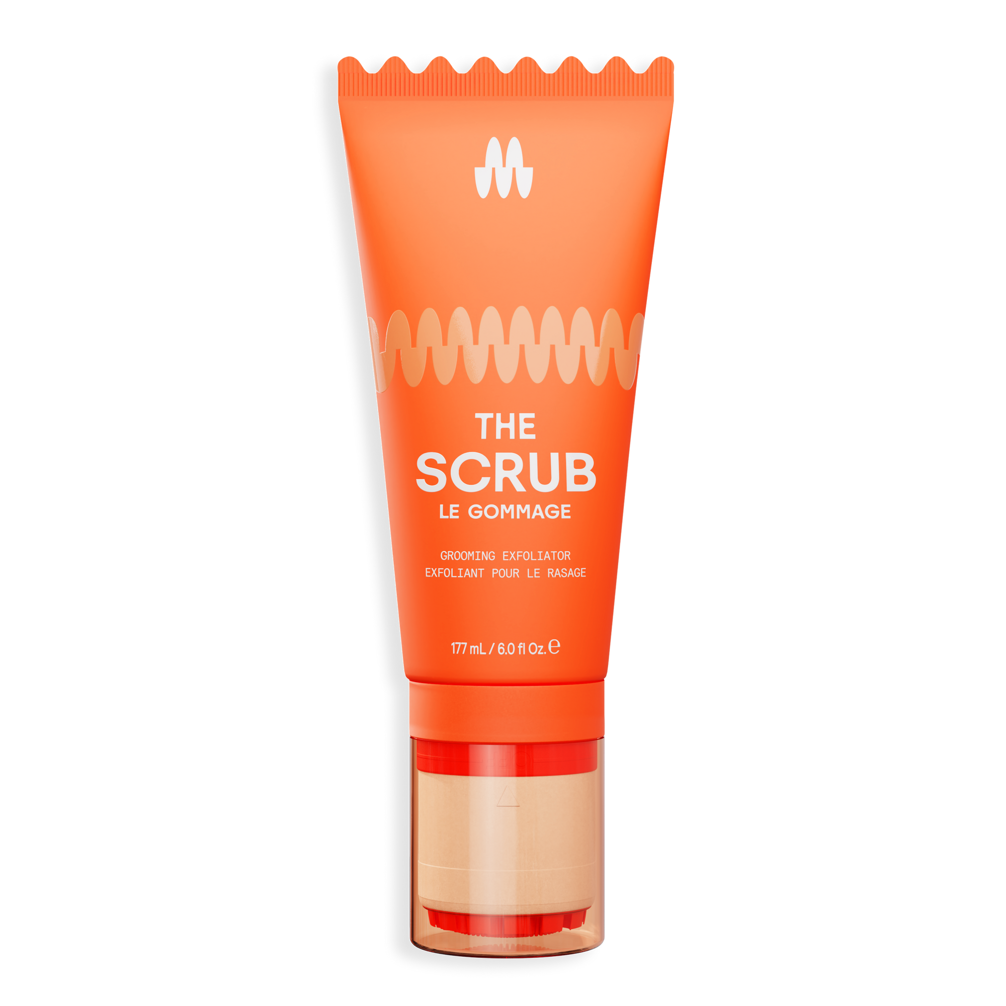 Orange exfoliating face scrub tube with gold and beige pump, labeled "The Scrub" for gentle skin renewal and detox.