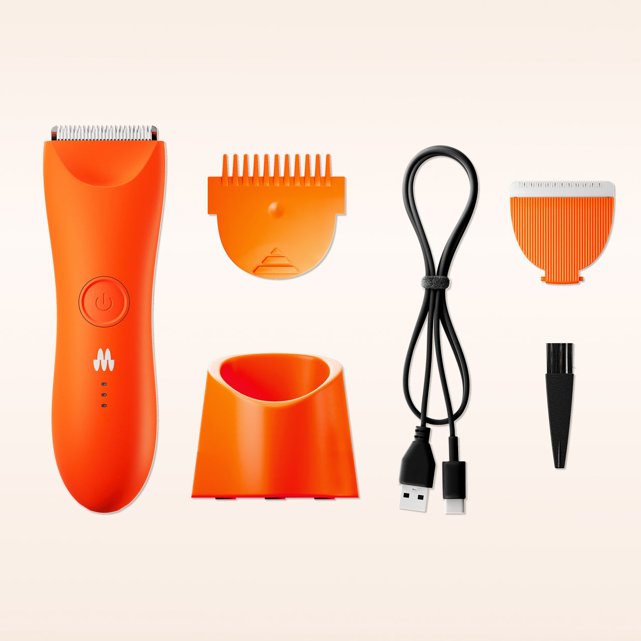 Orange cordless electric hair clipper with two detachable trimming guards, charging stand, USB charging cable, and cleaning brush.