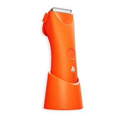 Cordless orange electric hair clipper with adjustable guard and charging stand, grooming tool for men and kids.