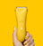 Yellow cordless electric hair clipper with power button held by hand with yellow and black nail art and floral tattoo on fingers.