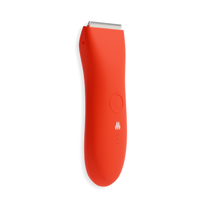 Compact bright orange electric hair trimmer with curved ergonomic design, power button, and precision stainless steel blades.