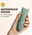 Green waterproof electric hair trimmer with water droplets held in hand, ideal for shower or travel grooming.