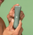 Man holding the Meridian Slimmer Trimmer in Sage color